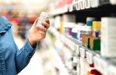 A woman reading the labelling of a product.  ©Getty Images 